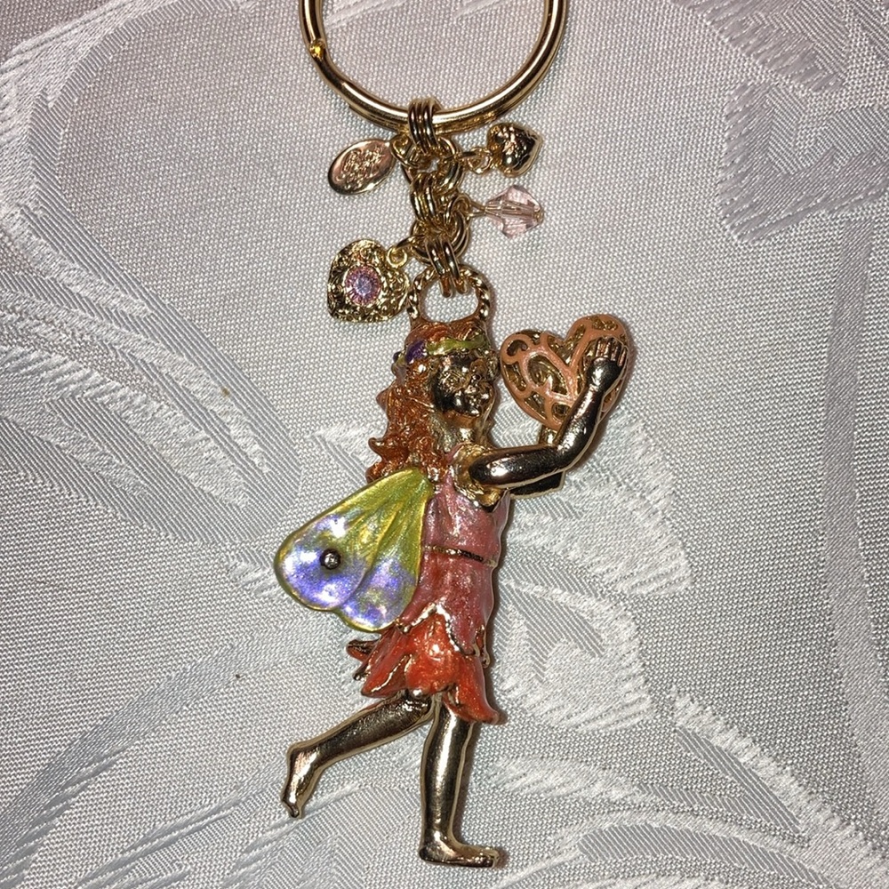 KIRK’S FOLLY gt fairy keychain holding heart with 4 sm. charms.    $25